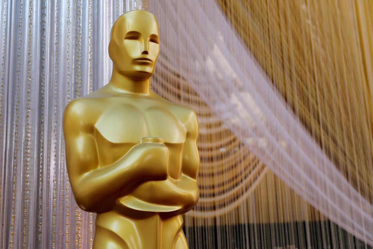 FILE PHOTO: An Oscar statue stands along the red carpet arrivals area in preparation for the 92nd Academy Awards in Los Angeles