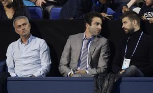 Manchester United manager Jose Mourinho and Barcelona and Spains Gerard Pique in the stands during the round robin match between Serbias Novak Djokovic and Austrias Dominic Thiem